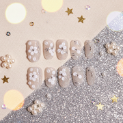 Ivory Petal Veil | Medium Oval Nude Press-On Nails with White Floral Accents, Silver Veining & Micro Sparkle