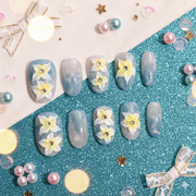 Seafoam Daffodil | Medium Oval Blue-Green Press-On Nails with Yellow Floral Accents & Crystal Centers